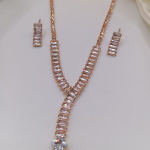 elegant rose gold necklace set with pink stones and diamond pendant